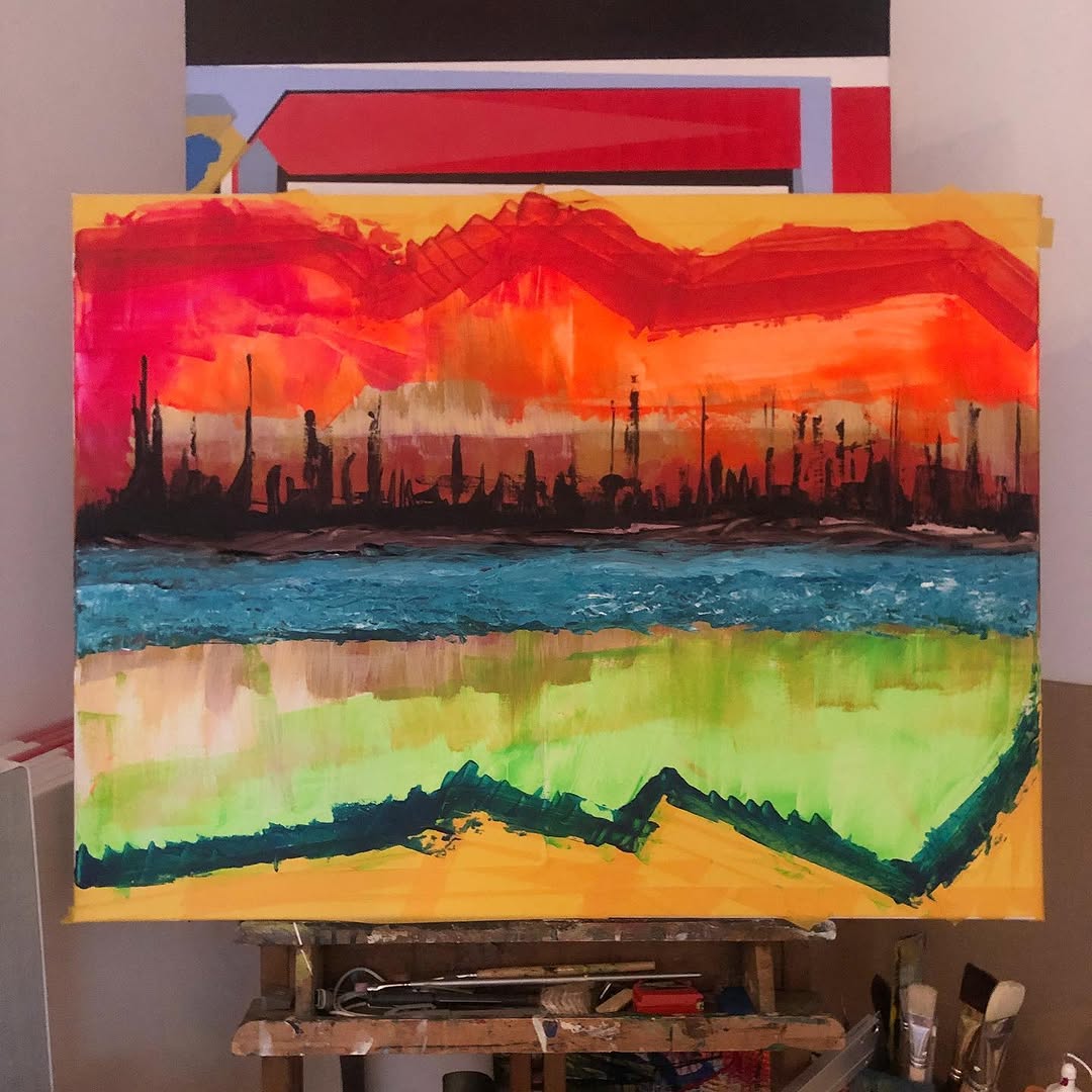 Expressieve skyline in rood, oranje, blauw en groen